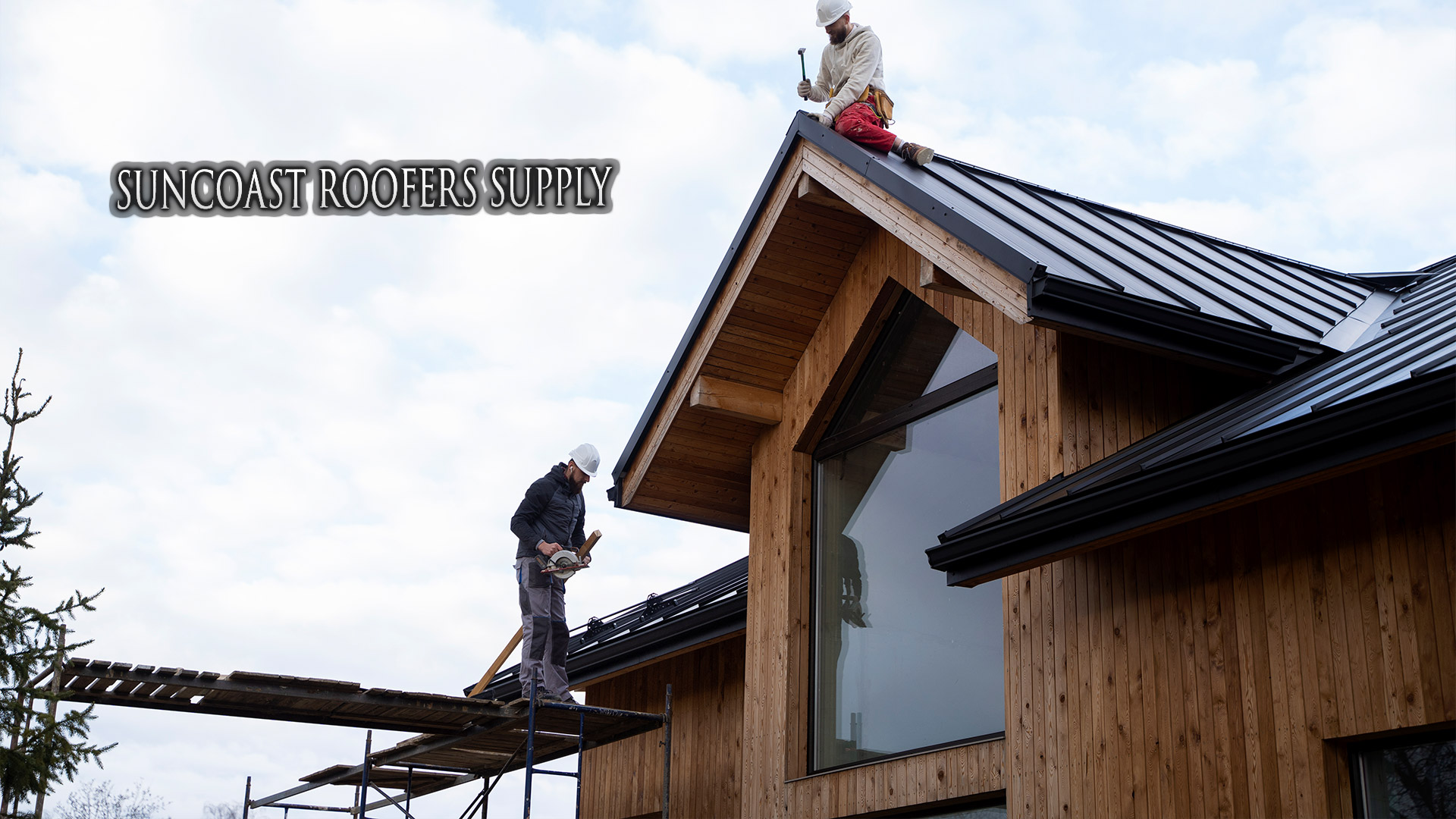 Contractor loading roofing materials from Suncoast Roofers Supply truck at a residential job site in Florida.